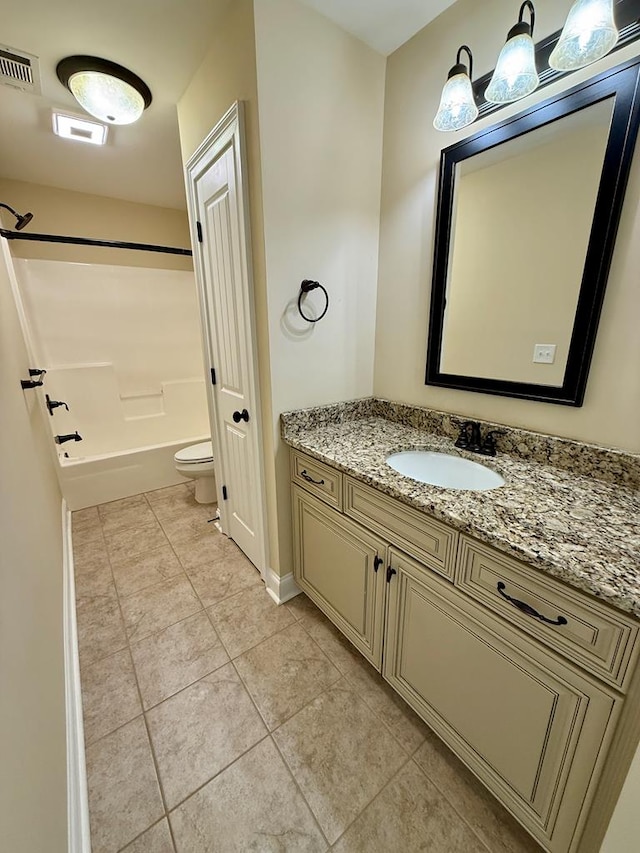 full bathroom with shower / bath combination, vanity, tile patterned floors, and toilet