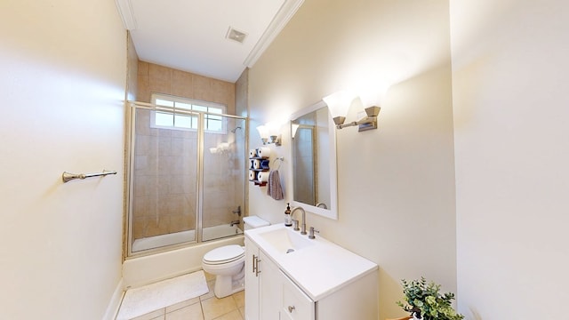 full bath with tile patterned floors, vanity, visible vents, toilet, and shower / bath combination with glass door