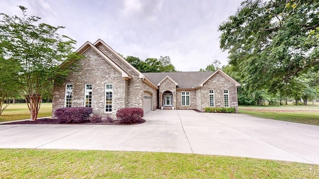 260 Cobb Rd, Dothan, AL 36301 - view of front of property featuring a garage, driveway, brick siding, and a front yard