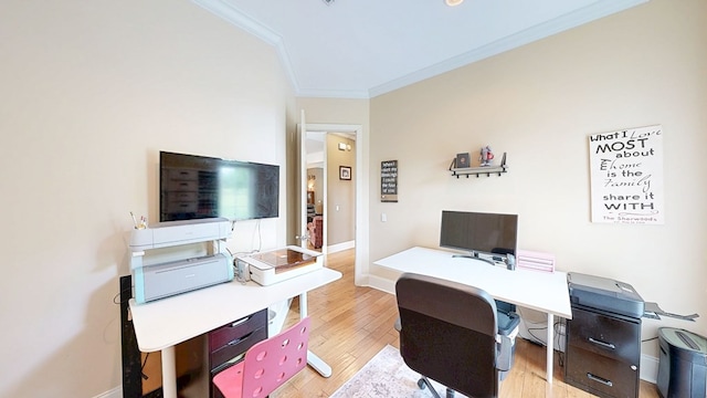 home office featuring light wood-style flooring, baseboards, and ornamental molding