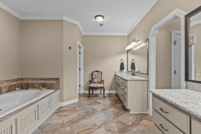 full bath featuring baseboards, ornamental molding, a garden tub, and vanity
