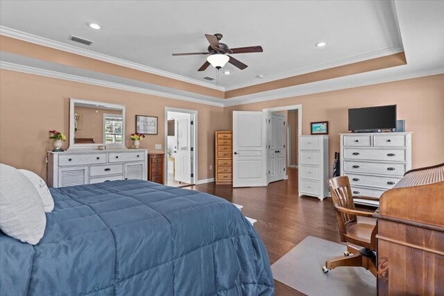 bedroom featuring dark wood-type flooring, visible vents, crown molding, and a raised ceiling