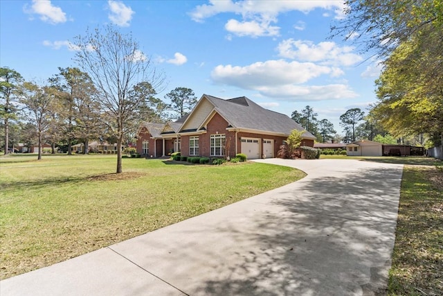 view of front of house featuring a front lawn, driveway, a garage, and brick siding
