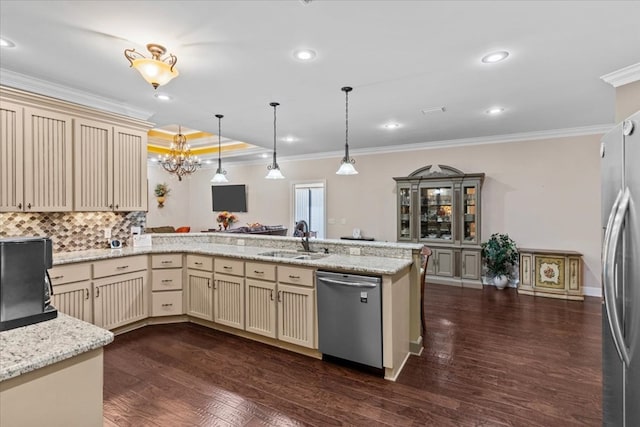 kitchen with a sink, cream cabinetry, and appliances with stainless steel finishes