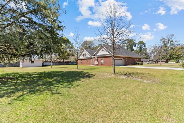view of front facade featuring driveway, a front yard, and a garage