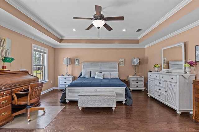 bedroom featuring a tray ceiling, visible vents, crown molding, and dark wood finished floors