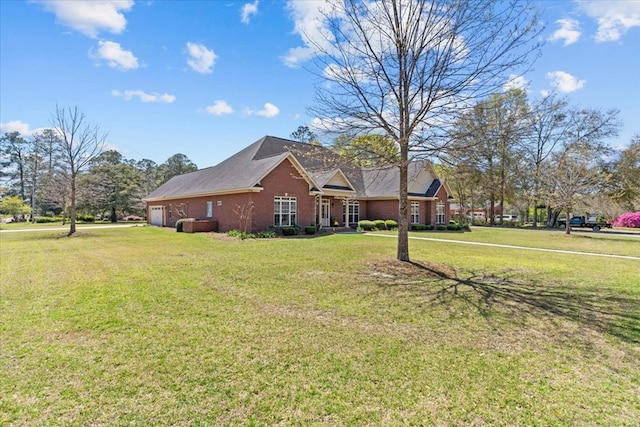 view of front of home featuring a front lawn and a garage