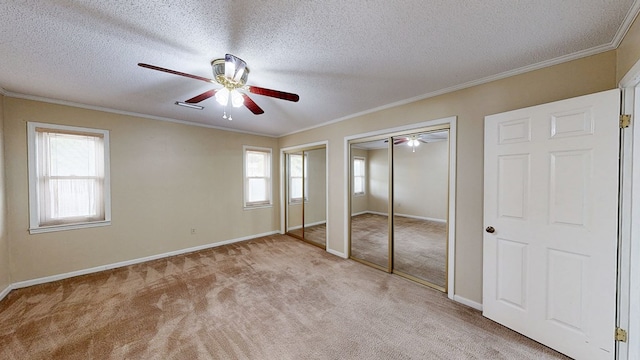 100 W Fontana Cir, Dothan, AL 36305 - unfurnished bedroom with multiple closets, carpet flooring, and multiple windows