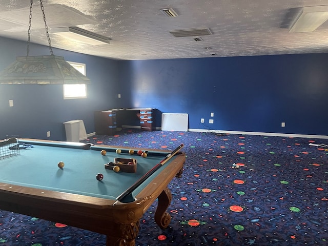 playroom featuring carpet flooring, a textured ceiling, and pool table