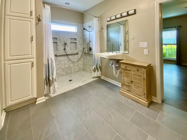 30 Cotton Creek Blvd, Enterprise, AL 36330 - bathroom with healthy amount of natural light, tiled shower, and tile patterned floors