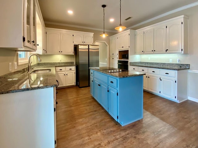 30 Cotton Creek Blvd, Enterprise, AL 36330 - kitchen with black appliances, blue cabinetry, white cabinets, dark stone counters, and ornamental molding