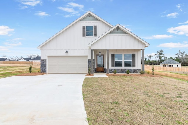 view of front facade with a garage and a front yard