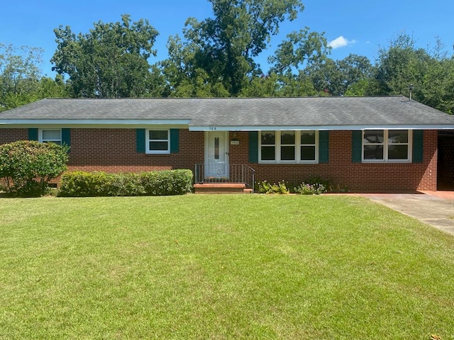 single story home with a front yard