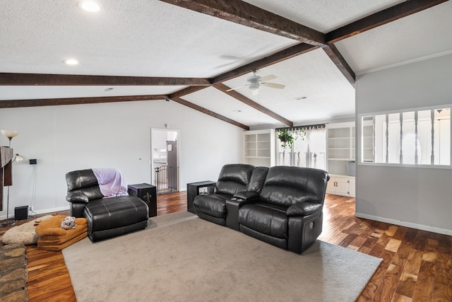 living room featuring ceiling fan, built in features, lofted ceiling with beams, dark hardwood / wood-style floors, and a textured ceiling