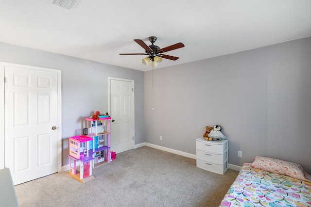 bedroom featuring light colored carpet and ceiling fan