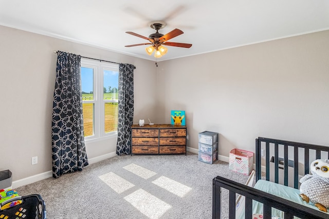 bedroom featuring light carpet and ceiling fan