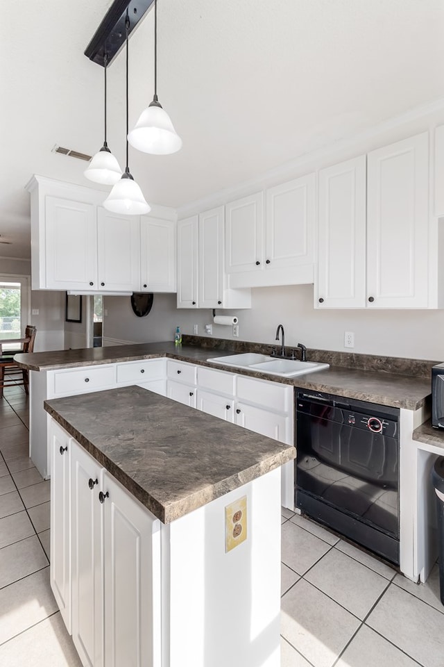 kitchen with white cabinets, dishwasher, sink, and decorative light fixtures