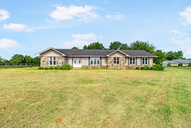 single story home featuring a front yard