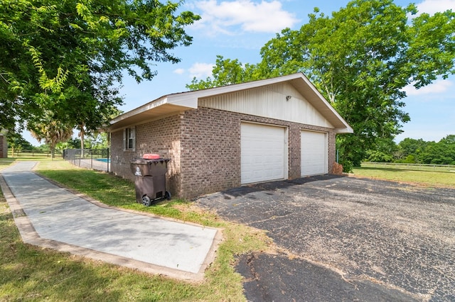 view of side of property featuring a garage