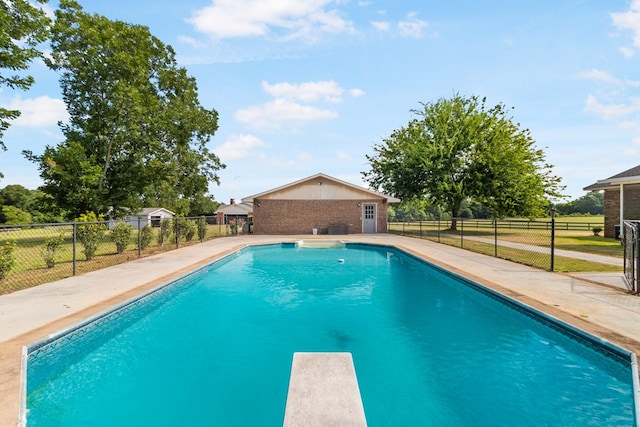 view of pool featuring a patio and a diving board