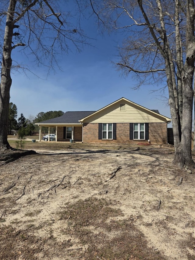 view of front of home with brick siding