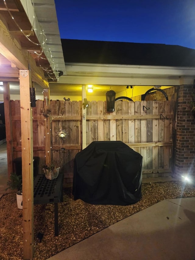 patio at night with area for grilling