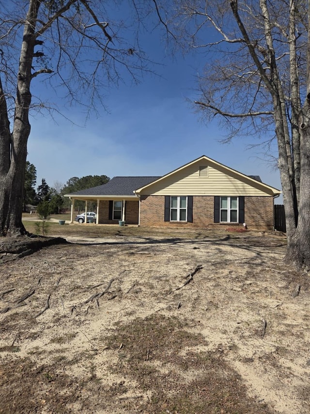 back of house with brick siding