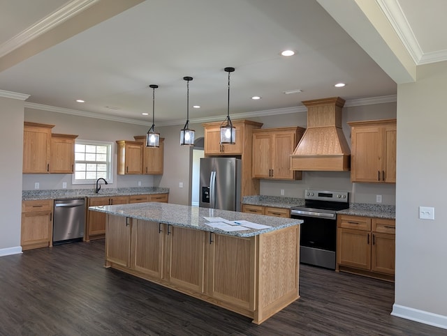 12589 Fortner St, Newton, AL 36352 - kitchen featuring stainless steel appliances, custom range hood, a kitchen island, dark wood finished floors, and light stone counters