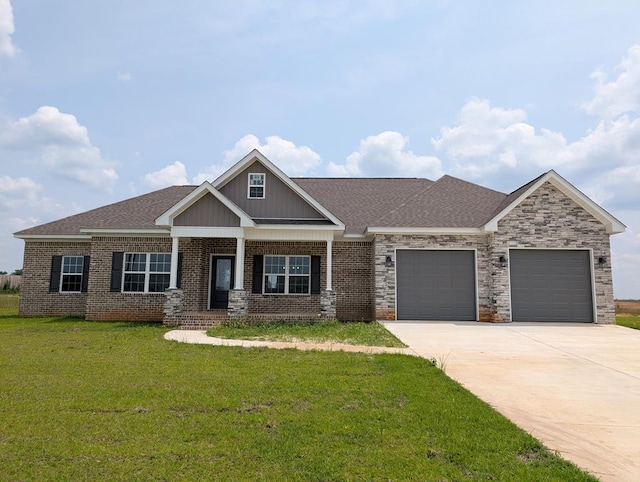 12589 Fortner St, Newton, AL 36352 - craftsman-style home with an attached garage, concrete driveway, a front yard, a porch, and brick siding