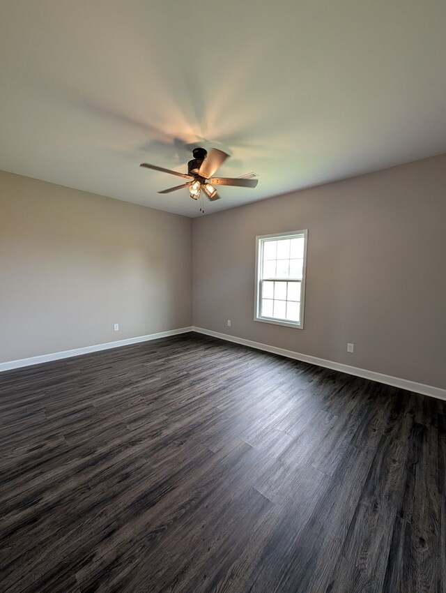 12589 Fortner St, Newton, AL 36352 - spare room featuring dark wood-style flooring, ceiling fan, and baseboards