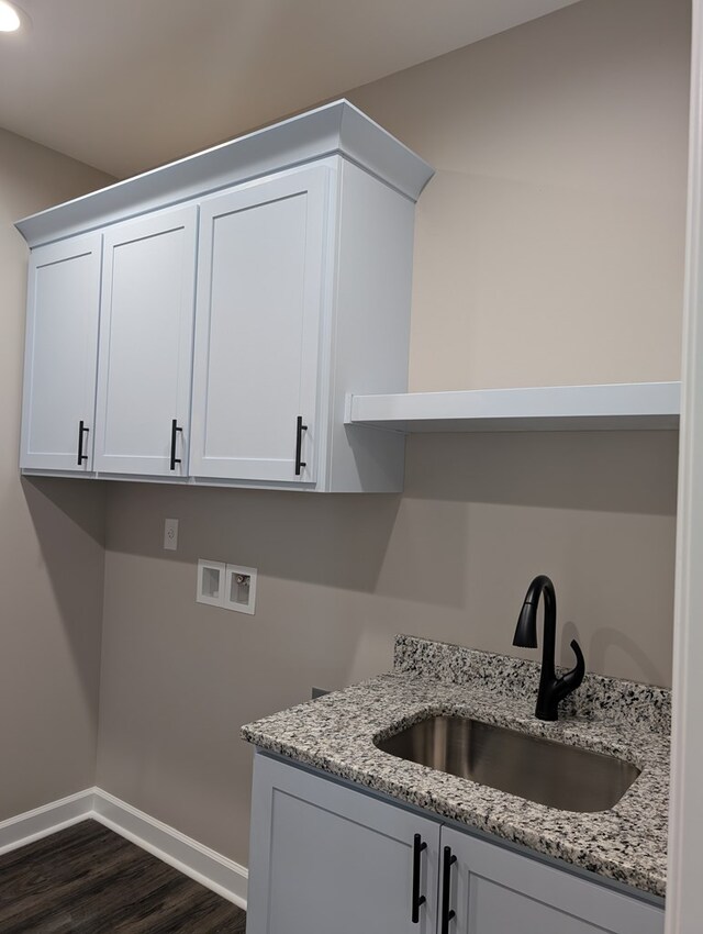 12589 Fortner St, Newton, AL 36352 - laundry area with cabinet space, dark wood-style floors, baseboards, washer hookup, and recessed lighting