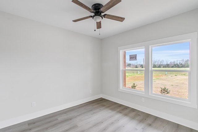 unfurnished room with light hardwood / wood-style flooring and ceiling fan