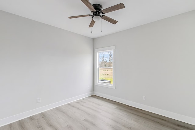 spare room with ceiling fan and light hardwood / wood-style floors