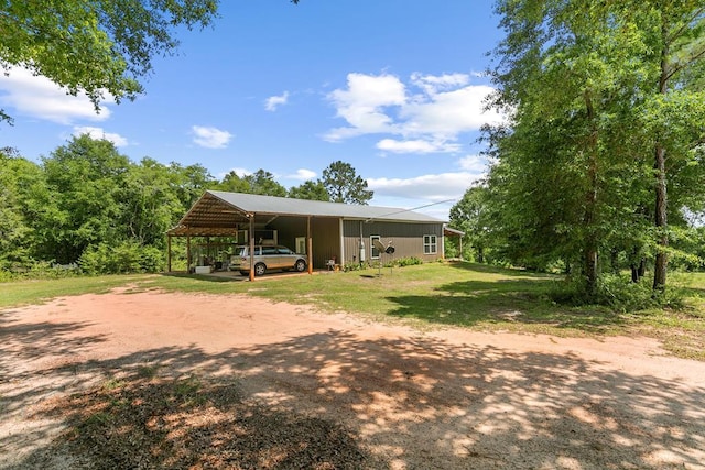 806 County Road 14, Midland City, AL 36350 - view of side of property with dirt driveway, an attached carport, and a lawn