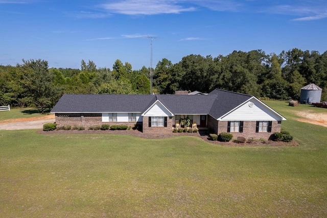 ranch-style house with a front yard