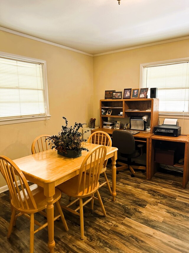 dining area featuring dark hardwood / wood-style floors and ornamental molding