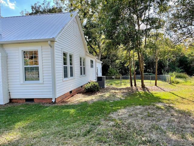 view of property exterior featuring a yard and central air condition unit