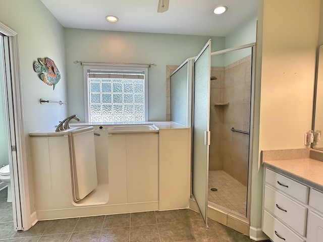 bathroom with a bath, recessed lighting, a stall shower, tile patterned flooring, and toilet