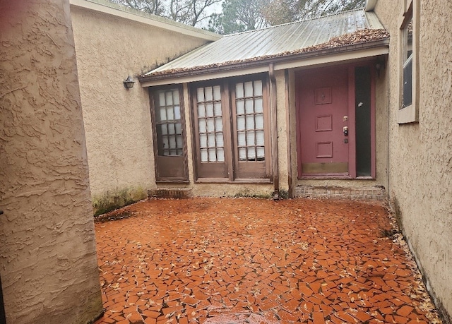 property entrance featuring french doors