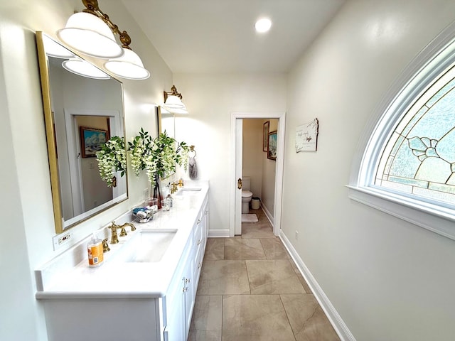 403 Stonegate Dr, Dothan, AL 36305 - bathroom featuring double vanity and toilet