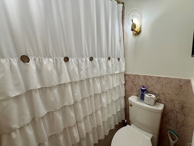 403 Stonegate Dr, Dothan, AL 36305 - bathroom featuring wainscoting and tile walls
