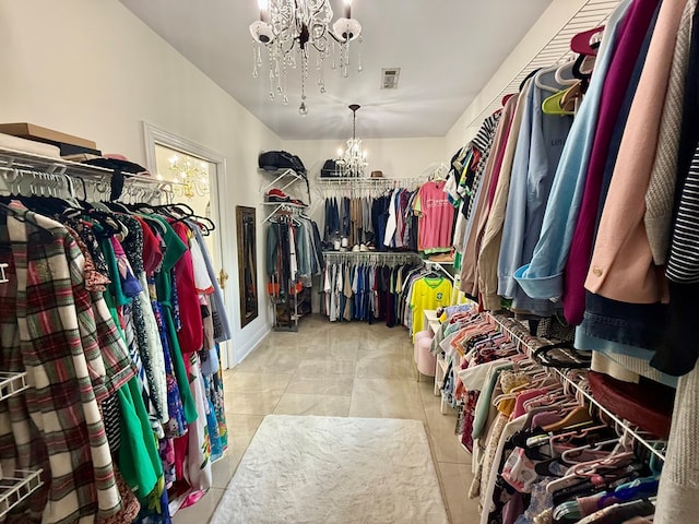 403 Stonegate Dr, Dothan, AL 36305 - walk in closet featuring a chandelier and tile patterned floors