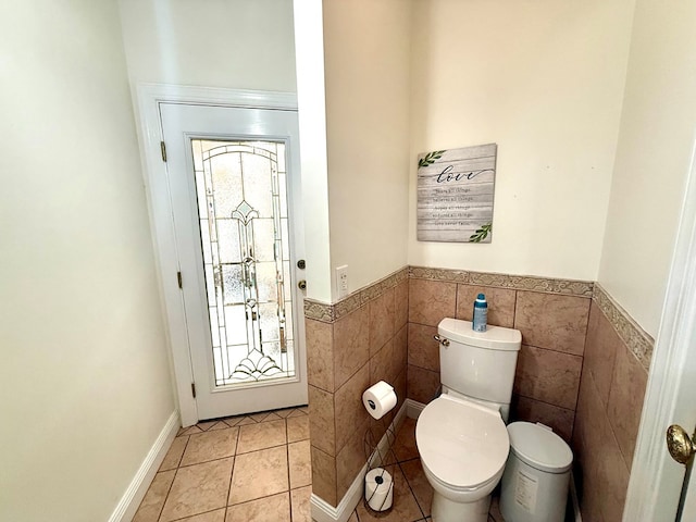 403 Stonegate Dr, Dothan, AL 36305 - bathroom with tile walls, a wainscoted wall, and tile patterned flooring