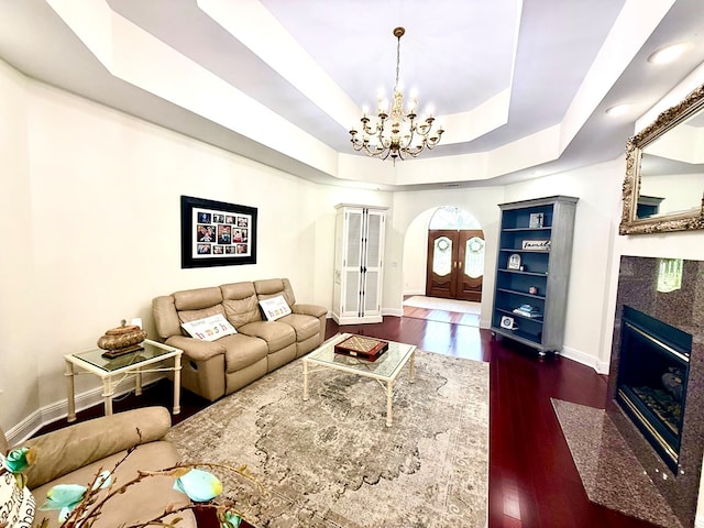 403 Stonegate Dr, Dothan, AL 36305 - living room with a chandelier, wood finished floors, and a fireplace with flush hearth