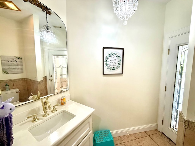 403 Stonegate Dr, Dothan, AL 36305 - bathroom featuring vanity, a chandelier, and tile patterned flooring