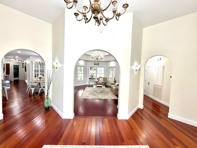 403 Stonegate Dr, Dothan, AL 36305 - entrance foyer featuring a chandelier, arched walkways, a high ceiling, and wood finished floors