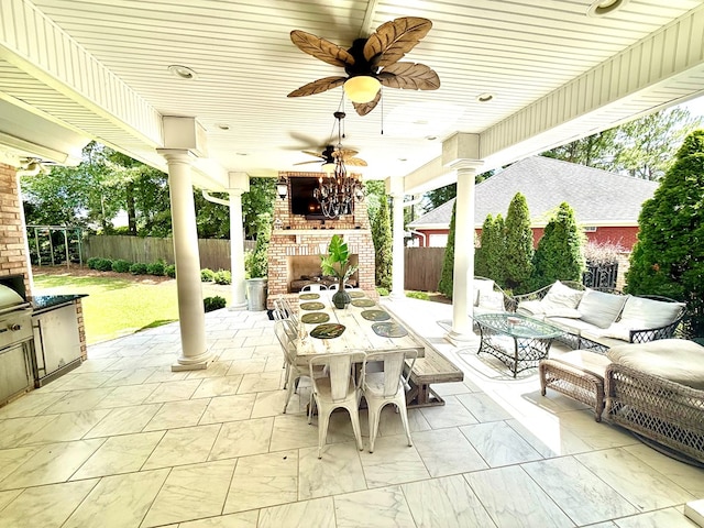 403 Stonegate Dr, Dothan, AL 36305 - fenced backyard featuring a patio, an outdoor living space with a fireplace, area for grilling, and outdoor dining area