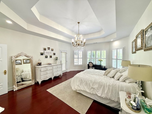 403 Stonegate Dr, Dothan, AL 36305 - bedroom featuring a chandelier, a tray ceiling, dark wood-type flooring, and recessed lighting