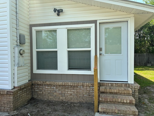 property entrance featuring fence