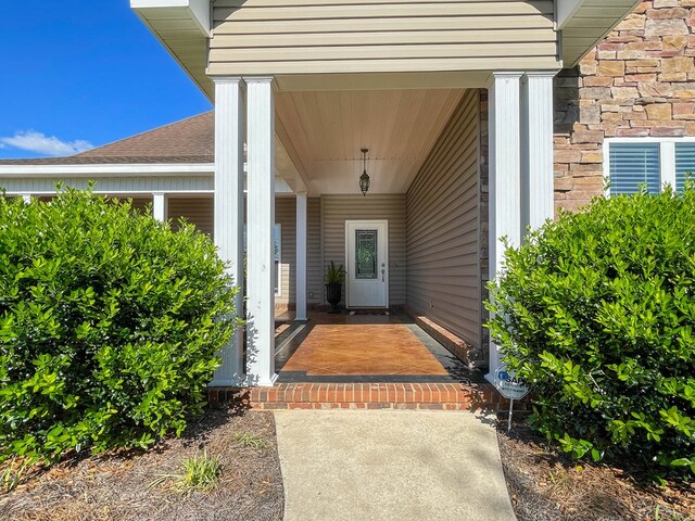 1621 Adkinson Rd, Newton, AL 36352 - doorway to property featuring a shingled roof and a porch
